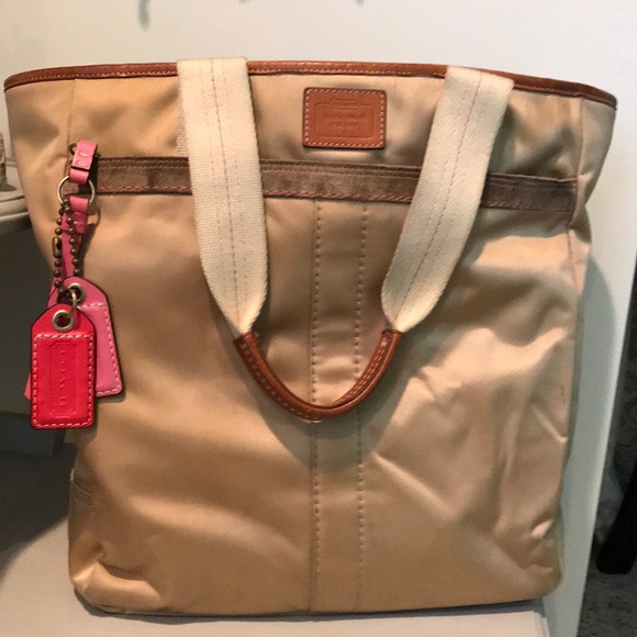 Coach Handbags - Large gold and pink Coach Hamptons weekend bag.